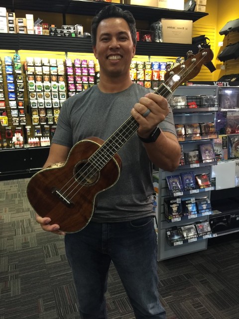 Carmelo holding an Ukulele that Jaime bought him